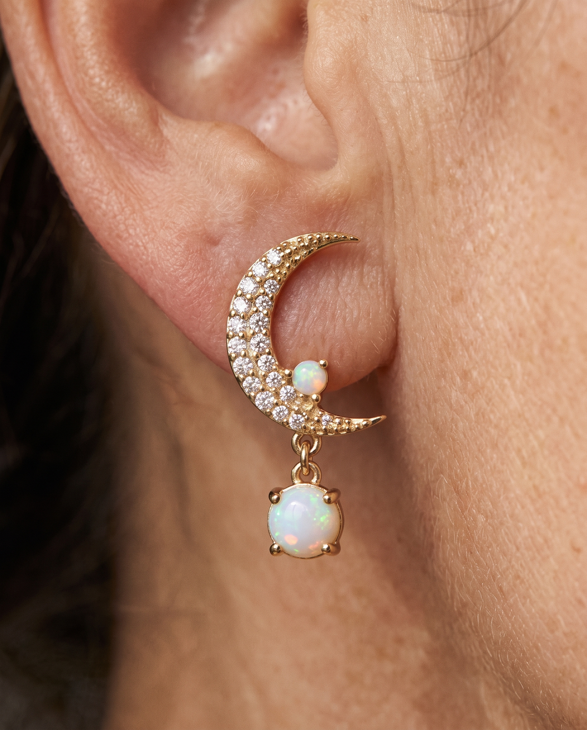 Opal Moon and Star Mismatched Earrings worn on a model